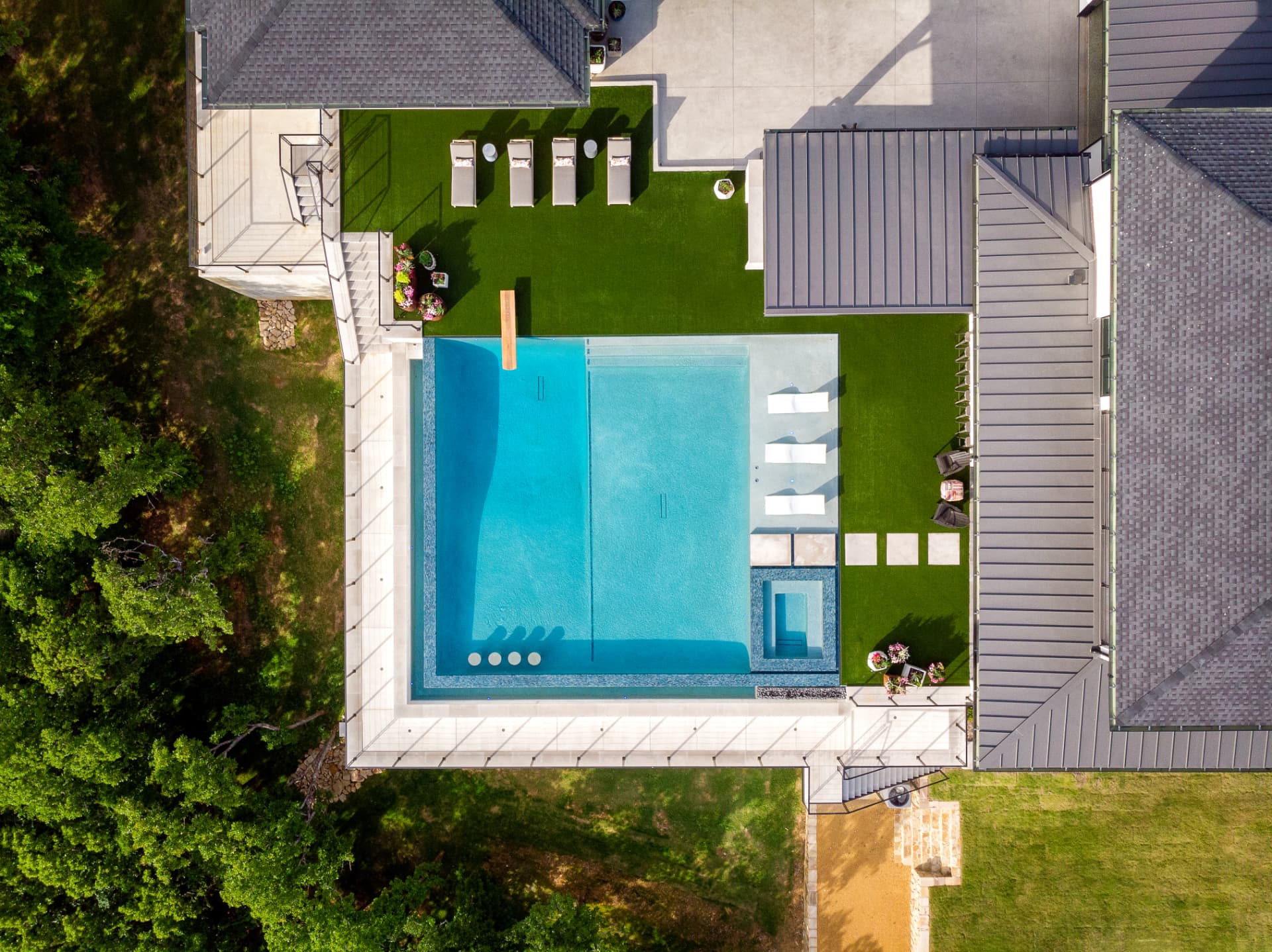 Aerial view of the pool, spa and turf lawn